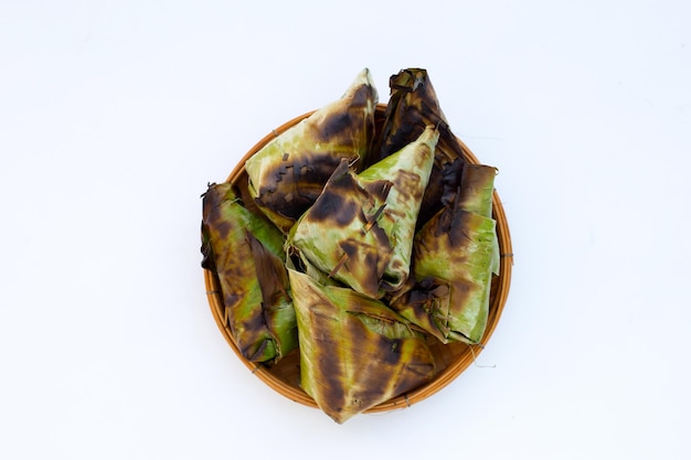 Grilled sticky rice in banana leave with mung beans filling