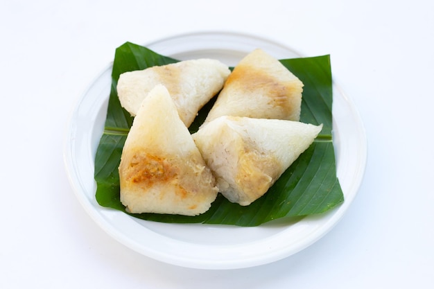 Grilled sticky rice in banana leave with mung beans filling