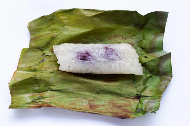 Grilled sticky rice in banana leaves with banana filling