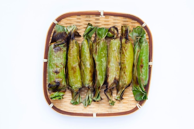 Grilled sticky rice in banana leaves with banana filling