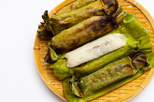 Grilled sticky rice in banana leaves with banana filling