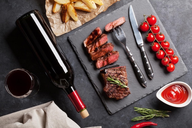 Grilled striploin steak and red wine