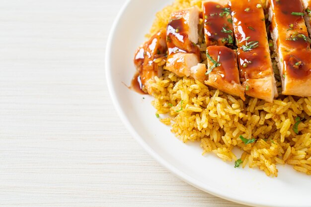 grilled sweet and chilli chicken with curry rice on plate