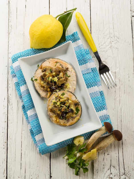 Grilled swordfish with mushrooms and lemon peel