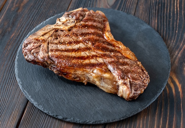 Grilled T-bone steak on the stone board