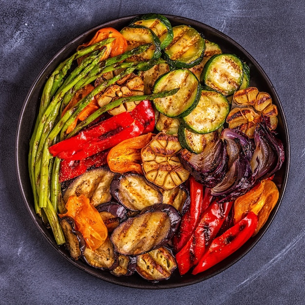 Grilled vegetables on a plate with sauce