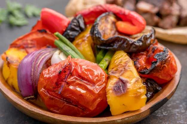 Grilled vegetables salad with eggplant, onions, peppers, asparagus and tomato