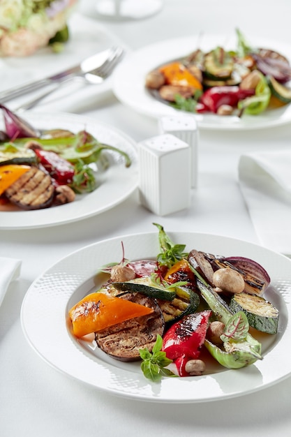 Grilled vegetables on a white plates. restaurant dish