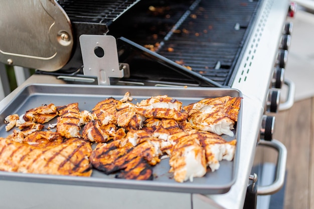 Grilling cod for fish tacos on outdoor gas grill.