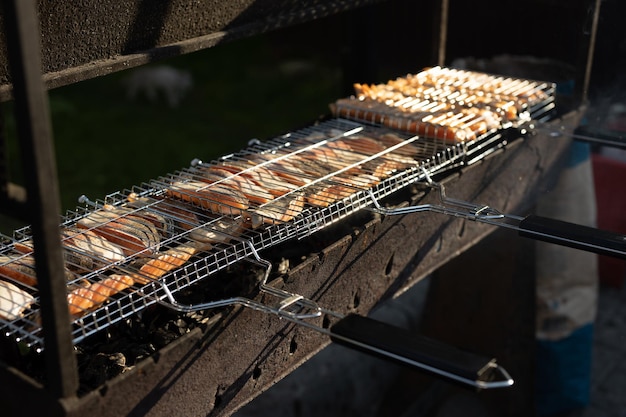 grilling fish on the grill at a picnic