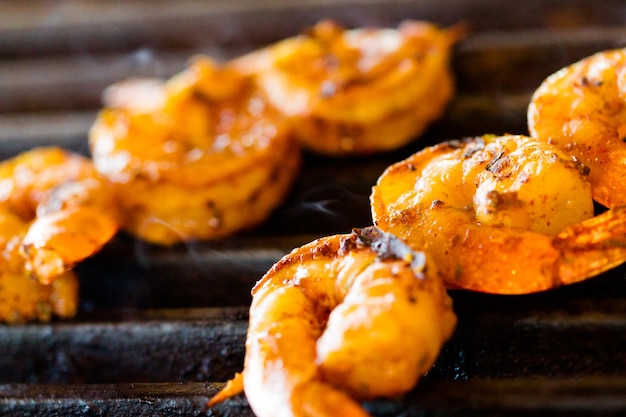 Grilling fresh shrimp on skewers.