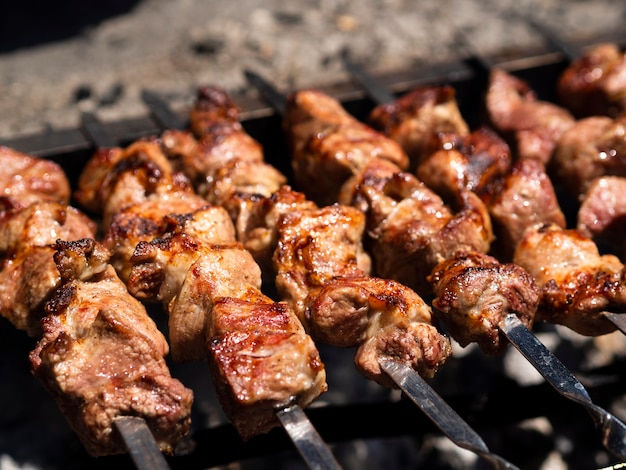 Grilling shish kebab with crust on skewers