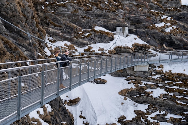 Grindelwald first Switzerland xAWoman on First Cliff Walk viewing platform on the First mountain in Grindelwald with Alpine views