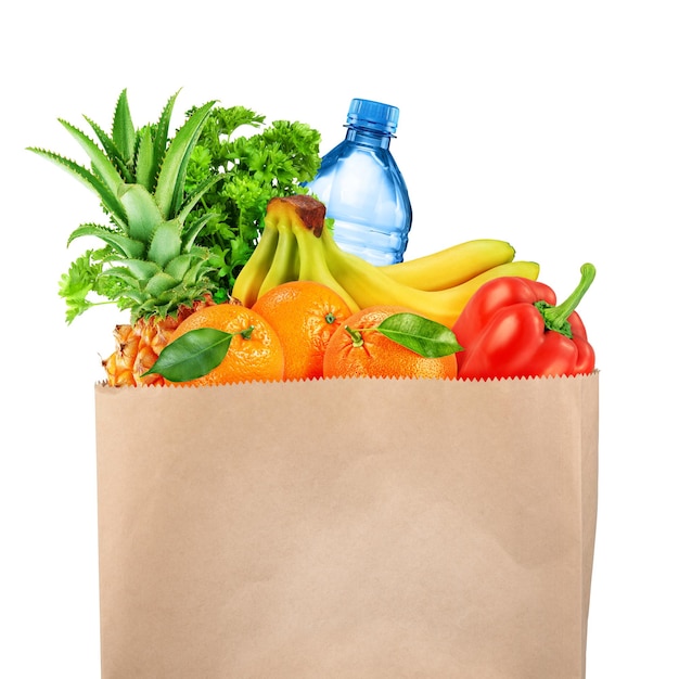 Grocery bag with fruits and vegetables isolated on white