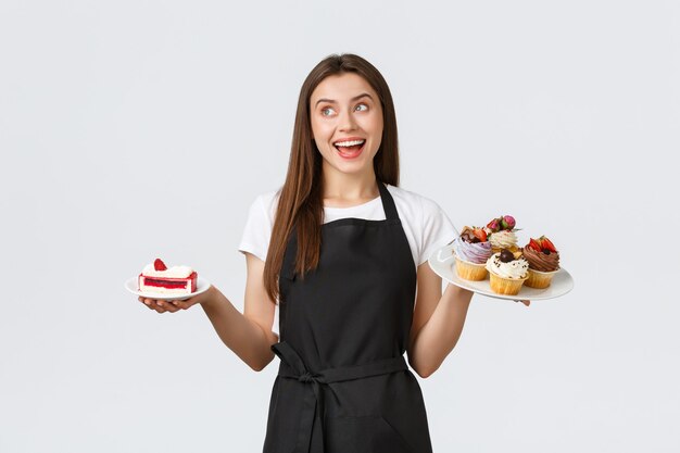 Grocery store employees small business and coffee shops concept friendly smiling waitress in cafe ho...