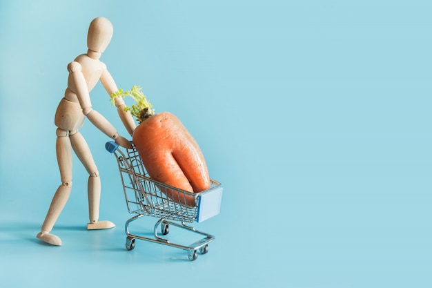 Grocery trolley with ugly abnormal carrot. 