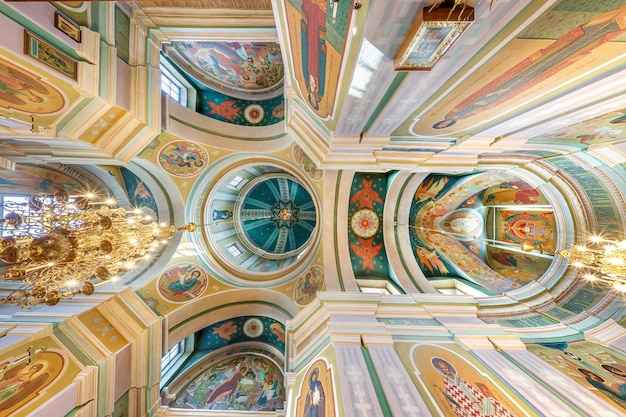 GRODNO BELARUS AUGUST 2022 dome and altar of orthodox church with arches and columns ceiling and vaulting with fresco