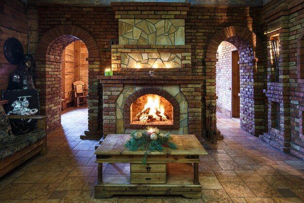 GRODNO BELARUS DECEMBER 26 2016 Interior of the guest room in the style of an ancient castle with a fireplace