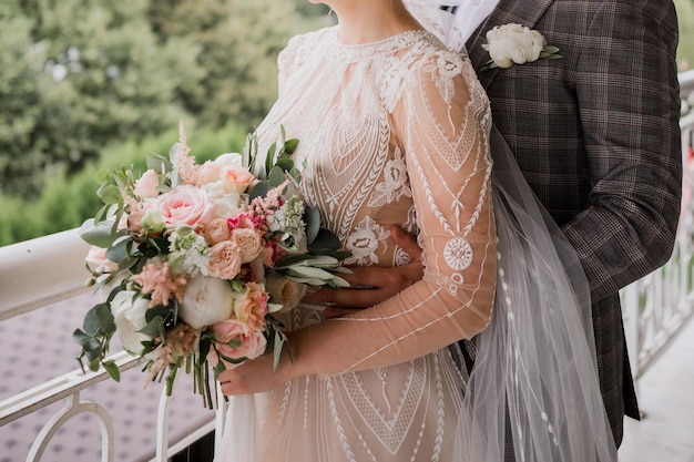 Groom and bride hugging together at the wedding