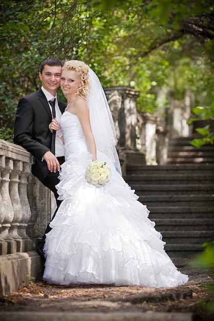 Groom and bride on walk in their wedding day