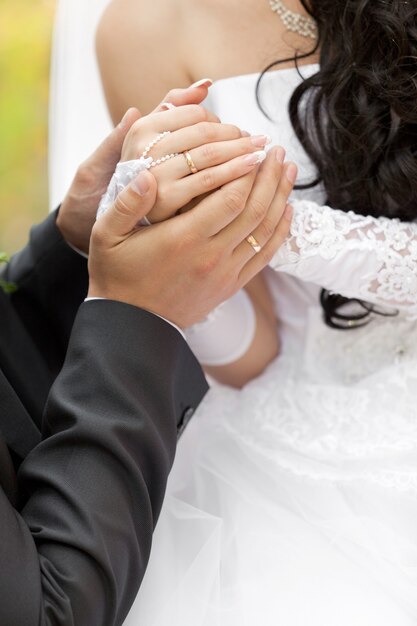 The groom embraces the bride