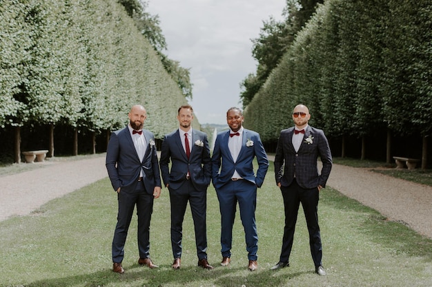 Groom and groomsmen having fun in park