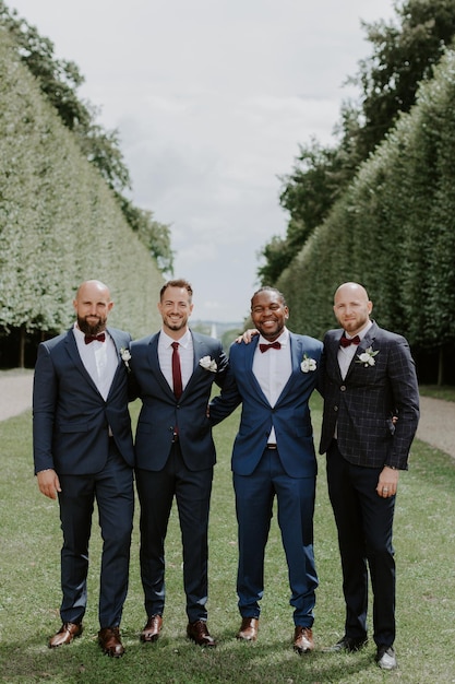 Groom and groomsmen having fun in park