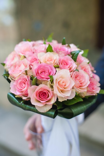 The groom is holding a bouquet