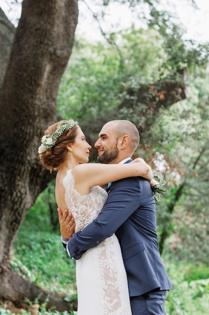 The groom looks at his wife lovingly