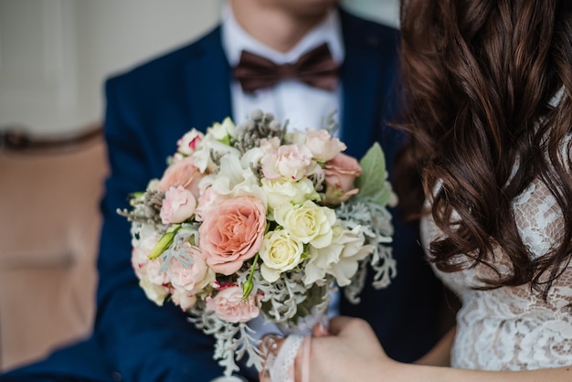 groom with bride wedding day bridal bouquet