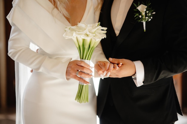 groom with wedding bouquet