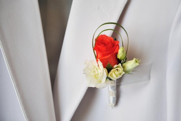 Groom39s red and white rose boutonniere