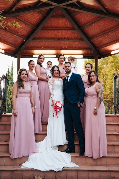 Grooms together with their bridesmaids and ring girls