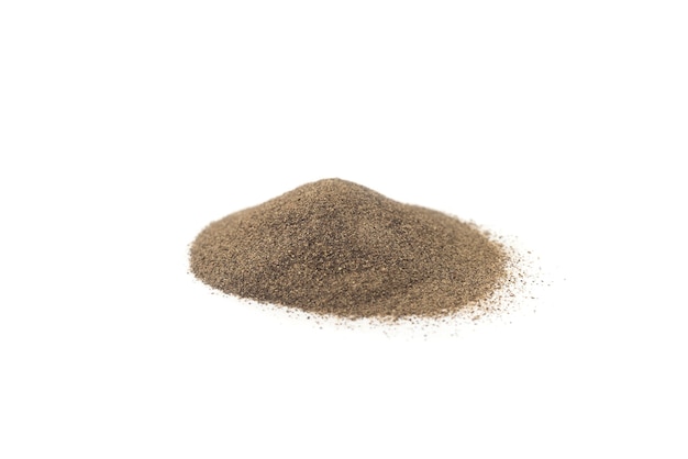 Ground black pepper isolated on white background. A pile of ground pepper.