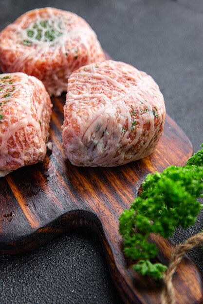 ground meat cutlet in fat grid fatty mesh pork, beef raw minced meat fresh meal food snack