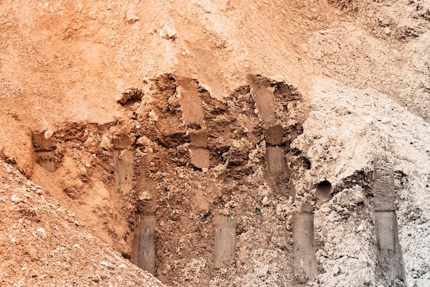 Ground sand and clay at the construction site closeup Background of excavated soil Earthworks at the construction site