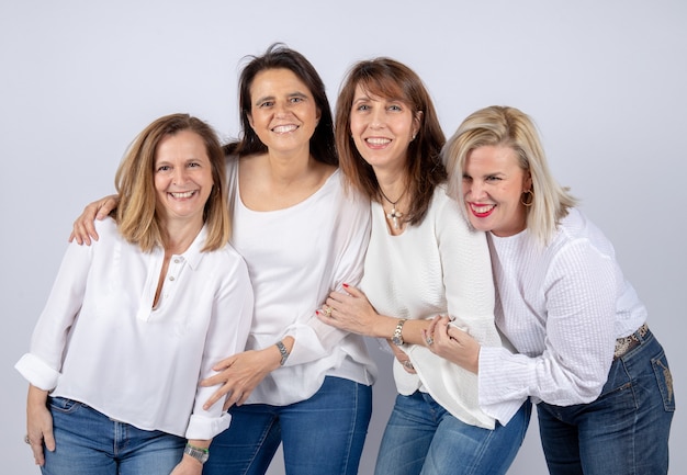 Photo group of 4 women, friends, middle-aged having fun in a photo session