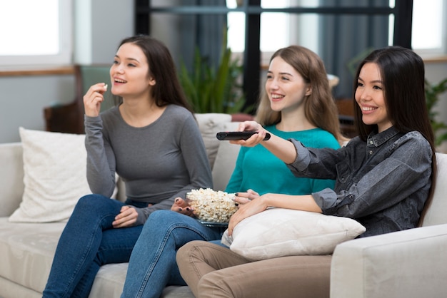 Group of adult females watching tv together