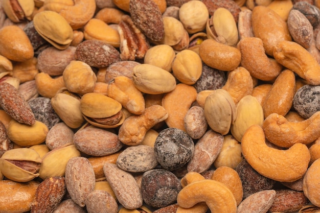 A group of almonds pistachios walnuts macadamia cashews