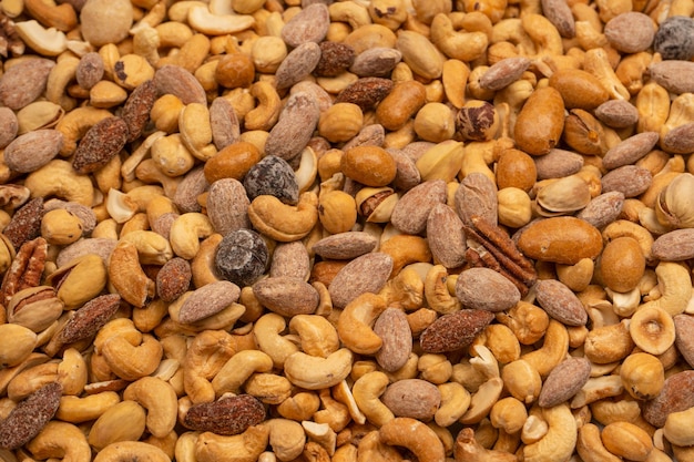 A group of almonds pistachios walnuts macadamia cashews