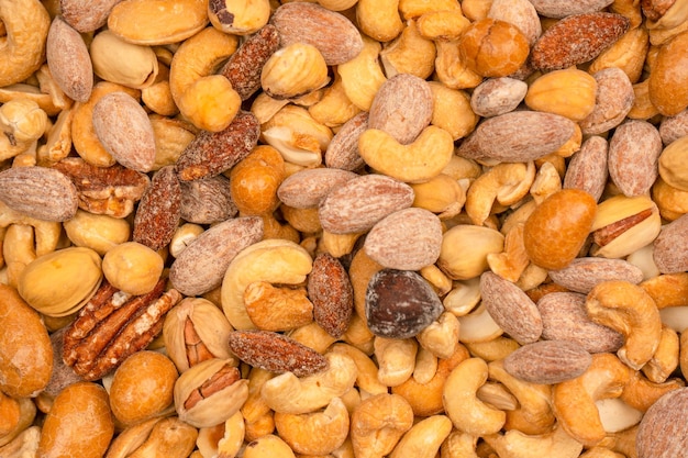 A group of almonds pistachios walnuts macadamia cashews