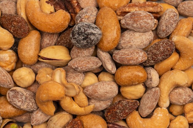 A group of almonds pistachios walnuts macadamia cashews