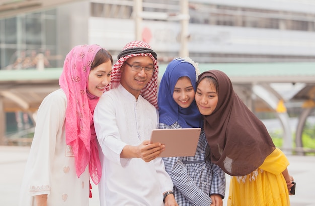 Group of Arab business man and woman  looking at  tablet