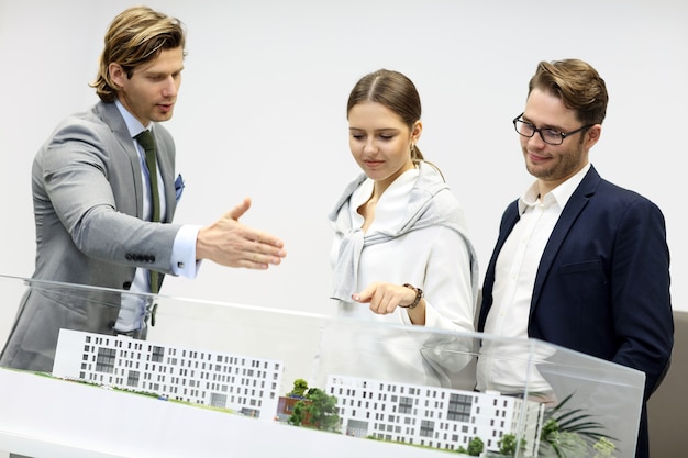 Group of architects sharing ideas in modern office