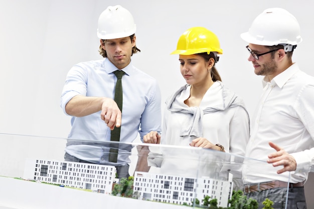 Group of architects sharing ideas in modern office