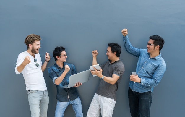 Group Of Asian and Multiethnic Business people using each technology equipment