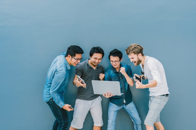 Group Of Asian and Multiethnic Business people using each technology