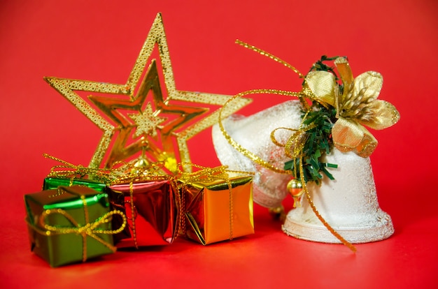 Group of bell, gift and star in christmas on red background