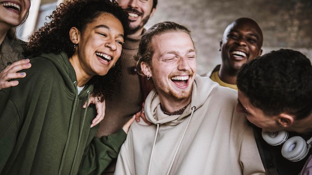 Group of best friends having fun laughing together outside