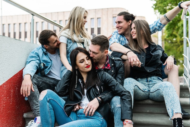 Group of best friends outdoor. Young people happy to see each other during a meeting.